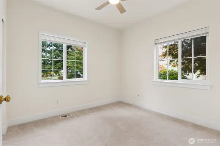 Bedroom 2 with new ceiling fan and full size closet.
