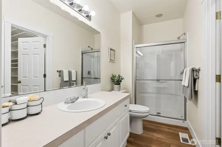 Primary attached bath with new shower and surround.