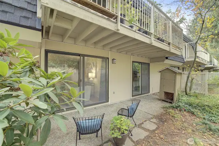 Another photo of the generous-size covered patio just off the living room and the bedroom of this comfortable home.  Add a table to those chairs, and maybe a barbecue, and think of the dinner parties you could have!