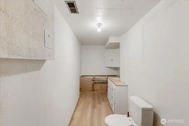 1/2 bath but plumbed for shower. Come finish this and make it your own