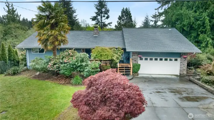 Front of home on Holly Lane with manicured landscaping