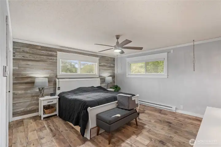 Primary room with accent wall, plenty of space for a king bed