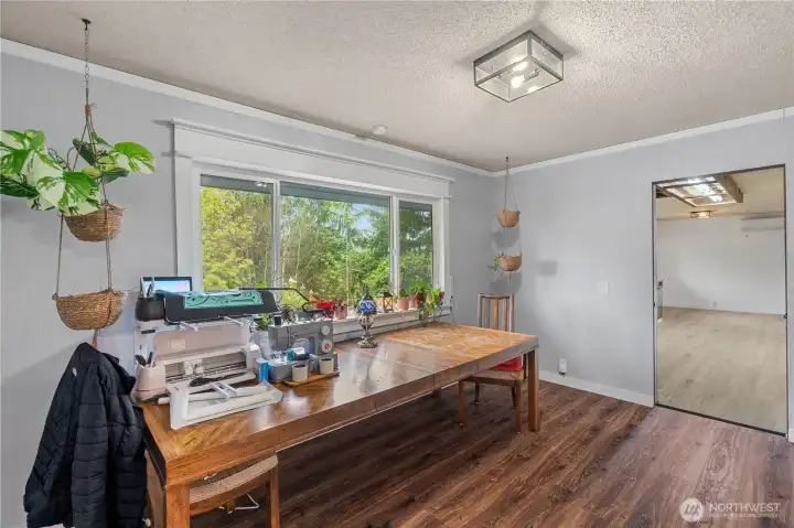 Dining area with windows looking to the trees out back