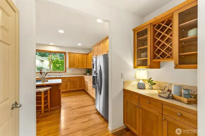 Thoughtfully positioned kitchen with center island, butler’s pantry, and walk-in pantry supports both everyday routines and gatherings.