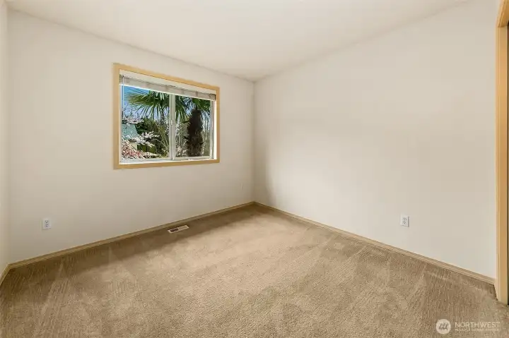 Well-proportioned secondary bedroom with ample light and adaptable layout.