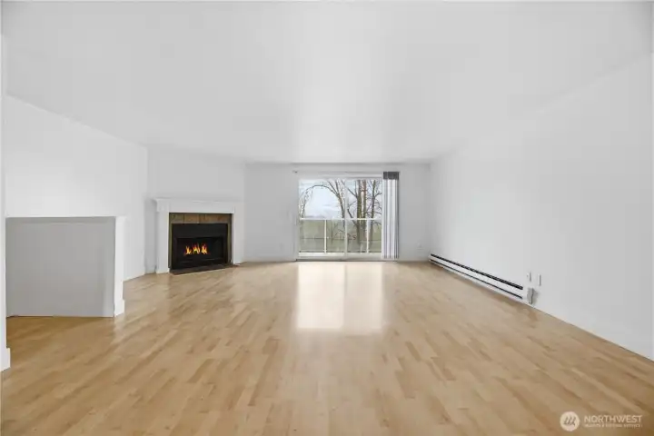 Living and dining area seamlessly flow together with private balcony just off the living room.
