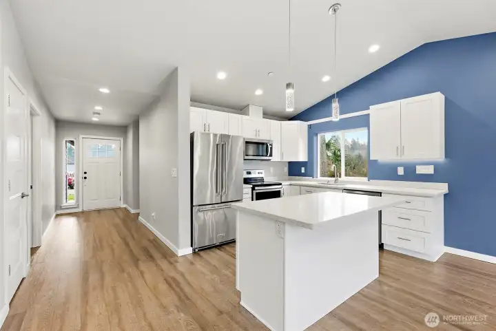 Gather with guests around the island in the kitchen
