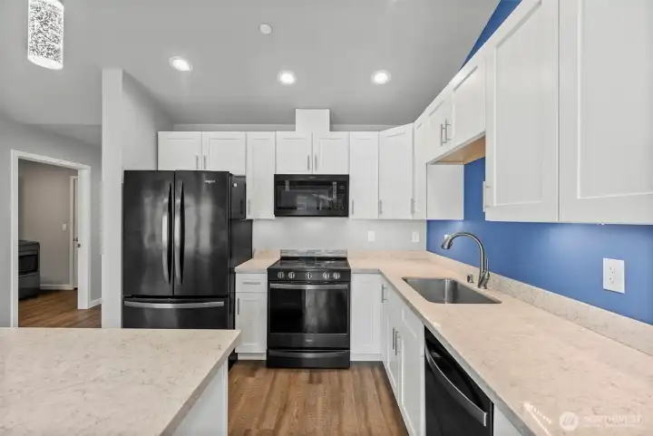 Soft close cabinets and gleaming countertops