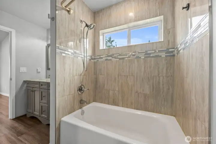 Primary suite with tiled shower