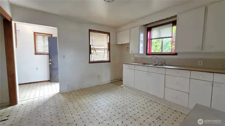 Large kitchen has room for an island cook center - tons of potential