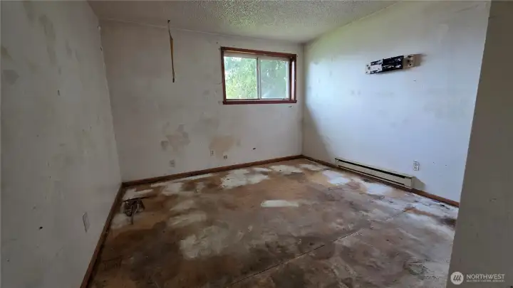 Front bedroom - carpet has been removed throughout the house to make a refresh easy.