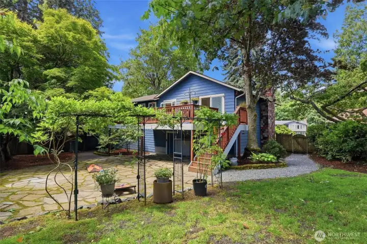 Beautiful Wisteria, Lilacs, Japanese Maples, Rhododendrons and so many more established plants to enjoy in this private serene yard.