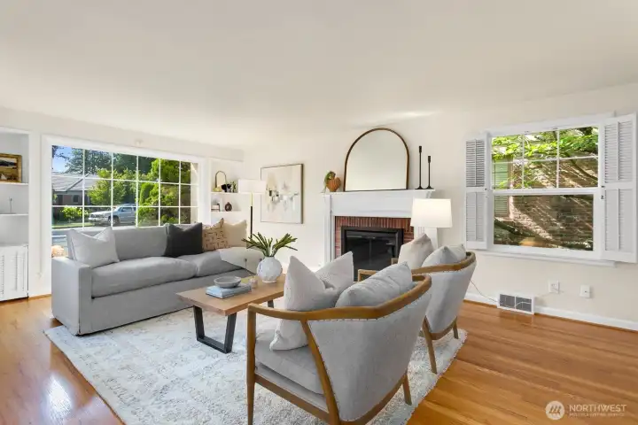 The formal entryway leads to the large living room on the left as you walk in. Three sides of windows here bring in so much light!