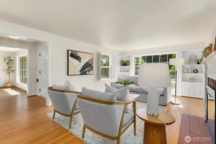 The entryway and dining room are pictured to the left in this photo.