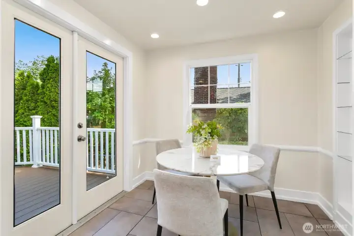 I adore this eating nook! The french doors lead to the private backyard. Entry to the garage is to the right (not pictured).
