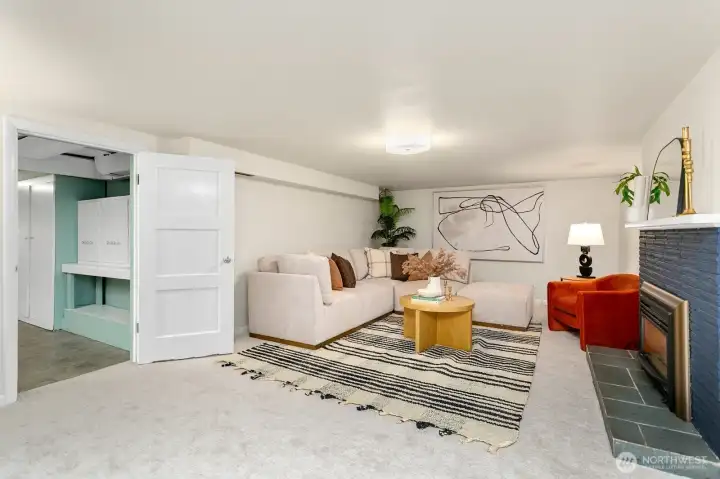 Head downstairs to the oversized rec room! Note the storage room off to the left.