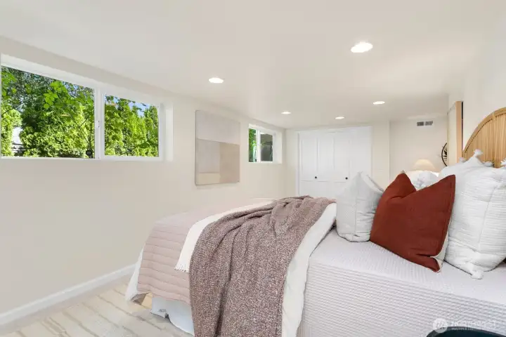 The third bedroom is full of light and easily can house a king-bed. Closet with organization too!