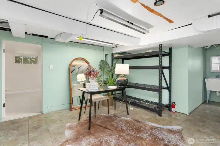 This unfinished space is full of potential! Perfect storage area, office, or future kitchen for an ADU?