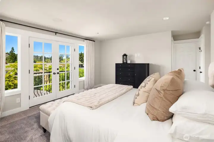 Primary bedroom with view and Juliet balcony. Primary bedroom with view and Juliet balcony.