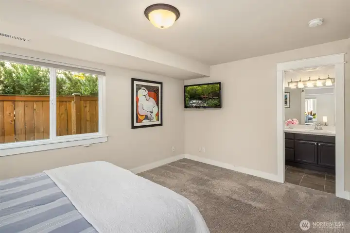 Lower floor bedroom with attached full bath. Lower floor bedroom with attached full bath.