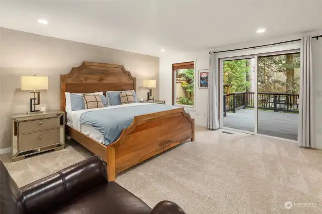 Retreat to two luxurious primary bedrooms, each boasting ensuite bathrooms, private balconies, and breathtaking water views. An additional bedroom with an adjacent bathroom offers convenience just across the hallway.