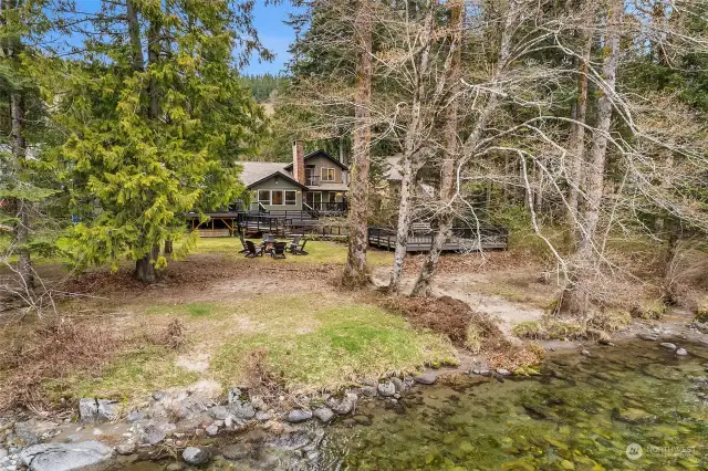79 feet of prime low-bank Skykomish riverfront, this property offers direct access to the tranquil waters.