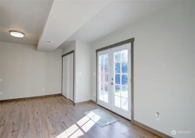 Door to deck with hot tub off main floor bedroom