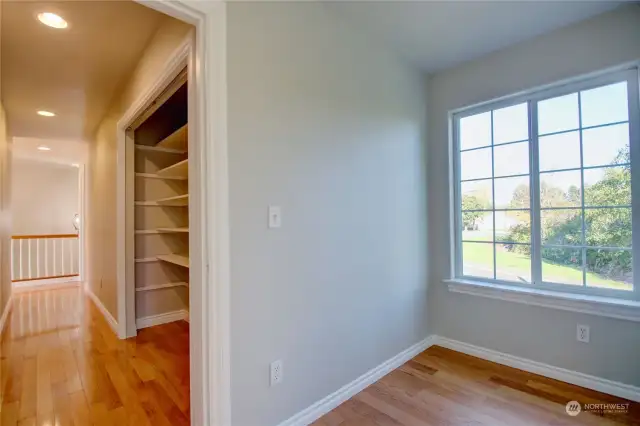 Den/Office on upper floor with great storage cabinet in hall.