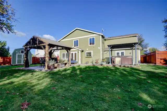 Backyard fully fenced, storage shed, hot tub and gazebo patio