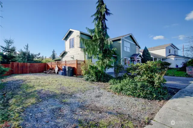 Additional parking area, fenced backyard.