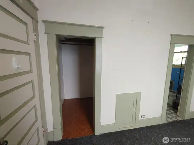 Main level bedroom with walk-in closet
