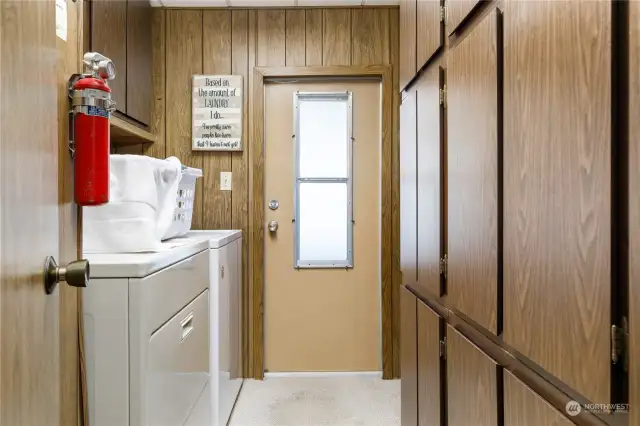 Utility room also exits to the ramp/steps and outside patio.  You can work out in the garden then put all your dirty clothes in the washer without tracking dirt through the house.  Abundance of storage cabinets