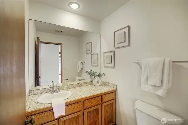 Powder bath between kitchen and dining room