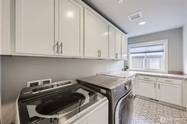 2nd Story utility room with plenty of storage space. Newer washer and dryer stay.