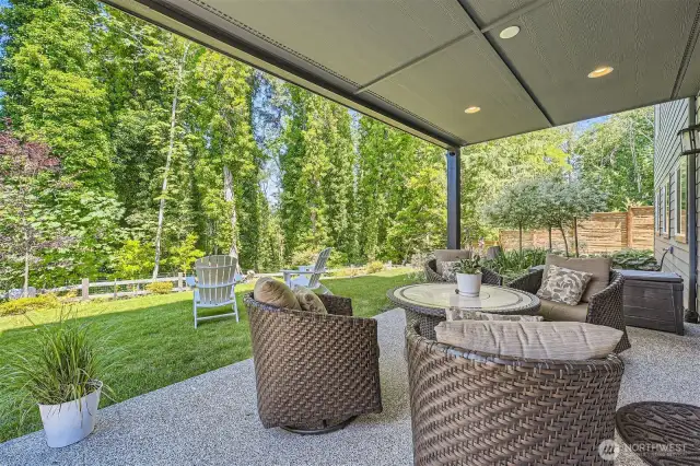 Lovely outdoor area off the basement level living quarters. Retractable sun-shade also installed.