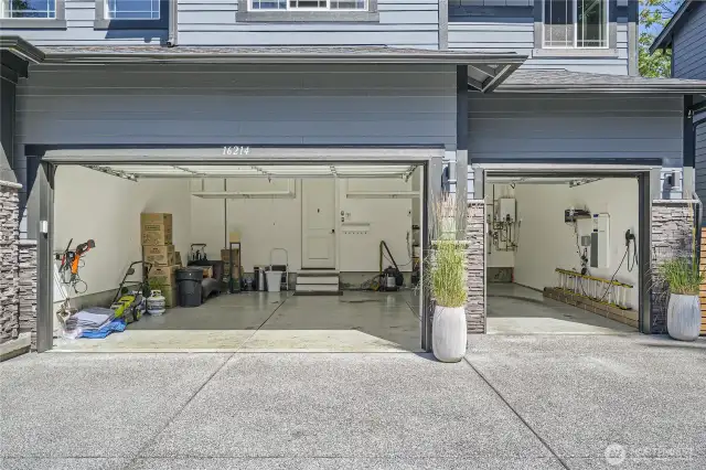 3 Car garage. 3rd bay is extra deep. Garage is fully insulated. Work bench and built-in storage. EV charger. Sprinkler system control panel.