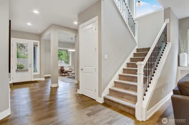 Inviting entryway with 10-foot ceilings. Front room / formal dining room off of entryway. Gorgeous wide plank hardwood floors.