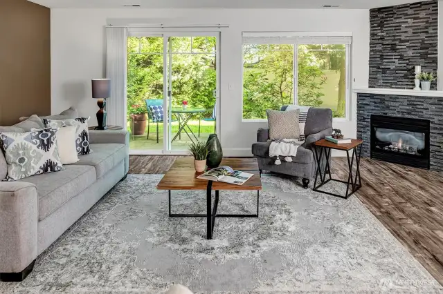 Living room anchored by a cozy gas fireplace that sets the scene for relaxed gatherings.
