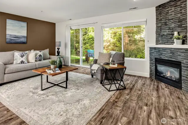 A wall of window and glass sliding doors lead to your private patio, with manicured lawns.
