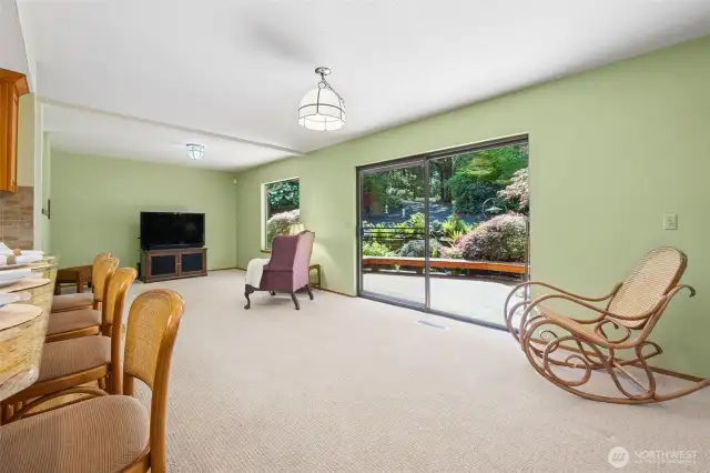 Sliding doors off family room lead to expansive deck.