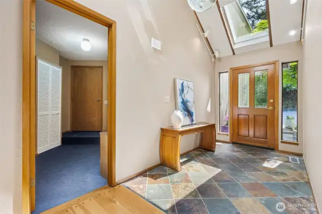 Mudroom off entryway leads to garage.