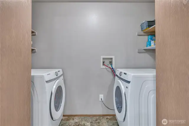 Laundry room with shelving.