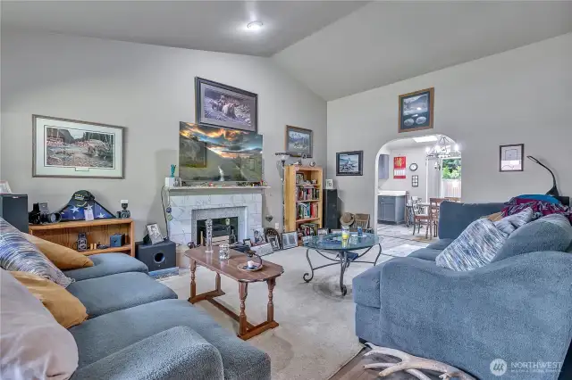 Relax or entertain in the living room accented with a fireplace.