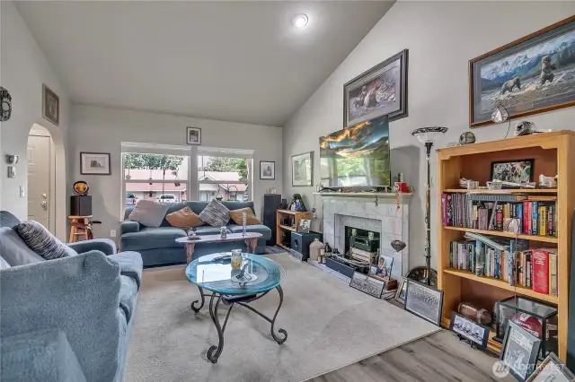 Vaulted ceilings and large windows give the living room a bright and spacious feel.