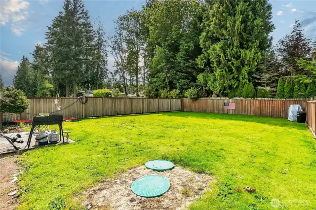 Fully fenced backyard adds privacy.