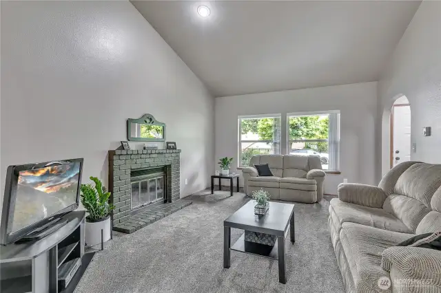 A cozy fireplace in the living room adds warmth.