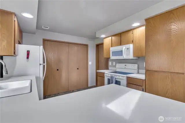 The kitchen features a pantry for extra storage.