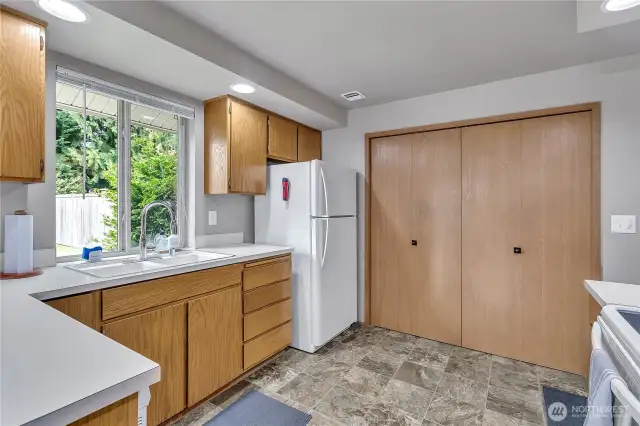 Ample cabinetry and a window to let in the natural light.