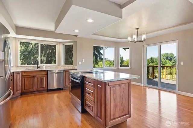 Warm wood cabinets deliver excellent storage and expansive counter space.