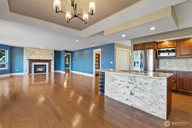 Open living area enhanced by an elegant, updated fireplace feature wall.